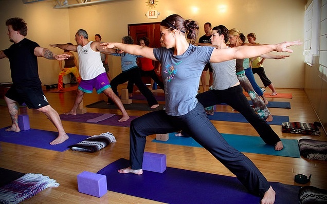 Girl doing yoga warrior pose