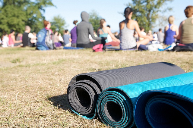 group yoga class with matts in foreground