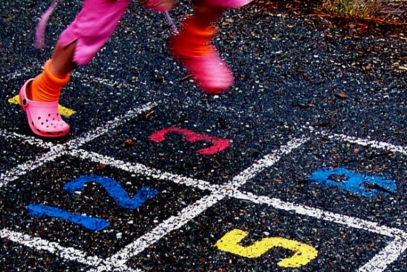 Girl Playing Hopscotch