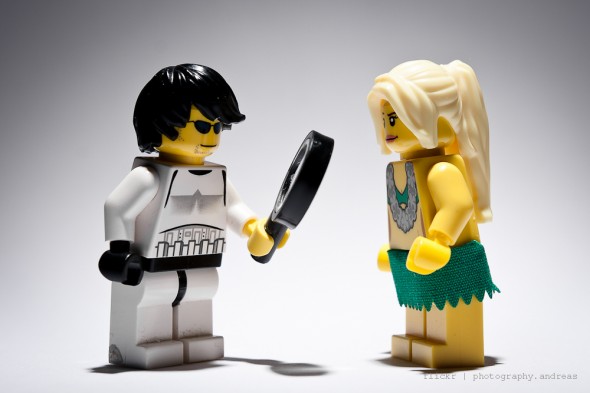 Storm Trooper holds magnifying glass up to girl, begins to build confidence