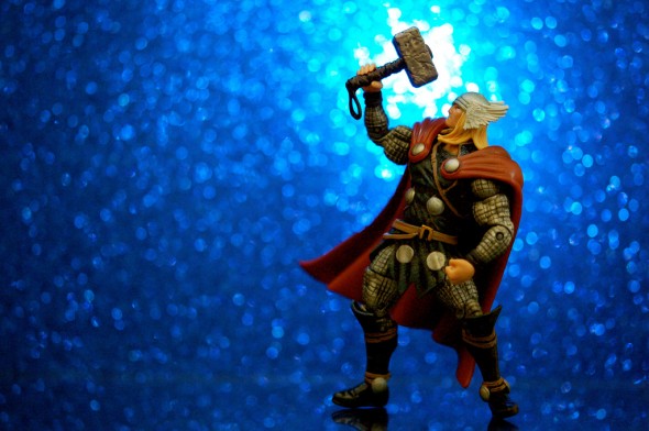 Thor Action Figure doing overhead press