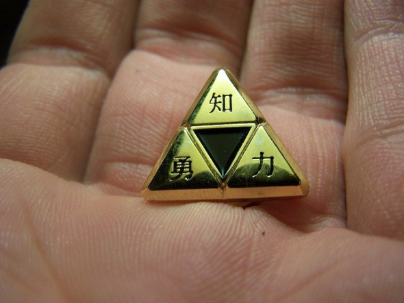 Triforce held in palm