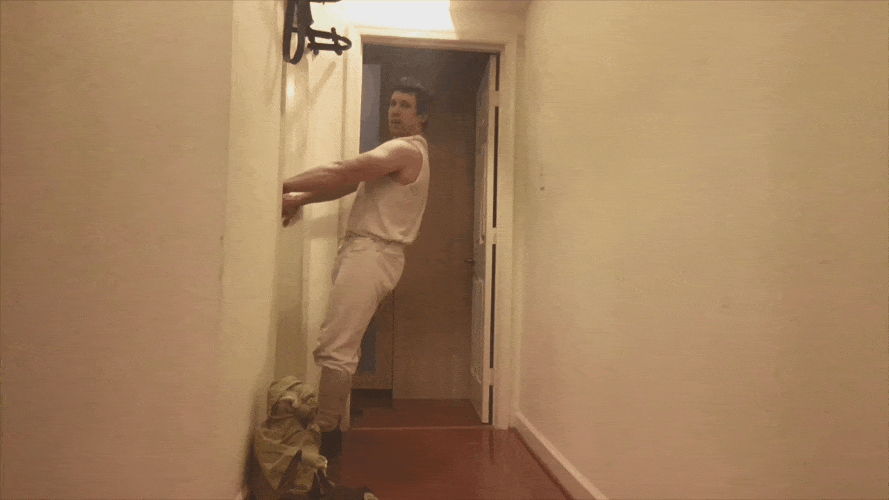 Simply grab the edge of your door frame and lean back.