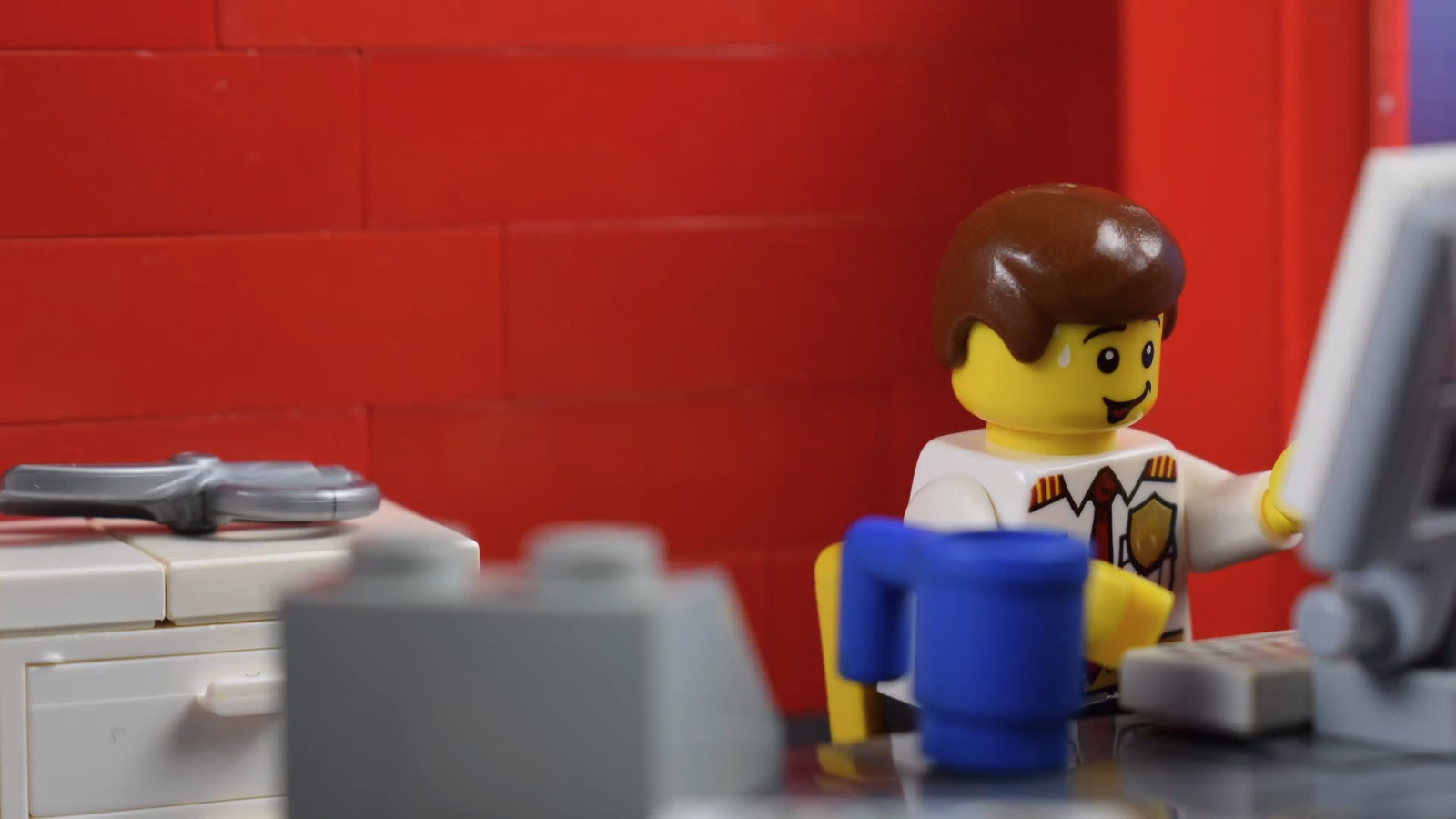 This LEGO is stoked his workplace is set up to his liking. 