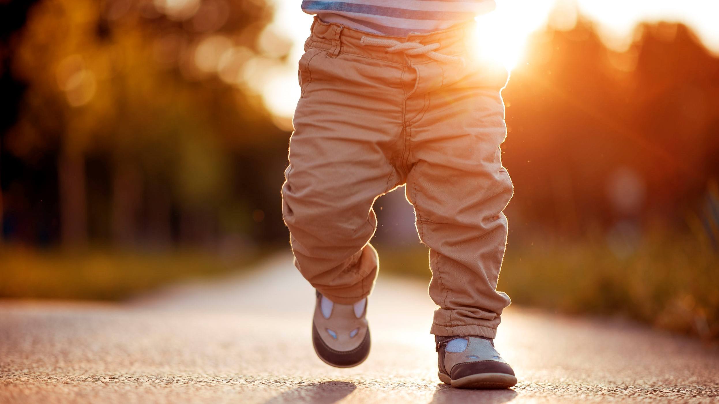 A baby taking a small step