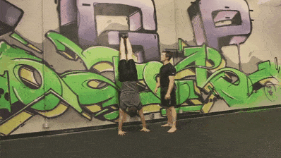 Steve showing you the "pirouette" so you can bail out of your handstand safely.