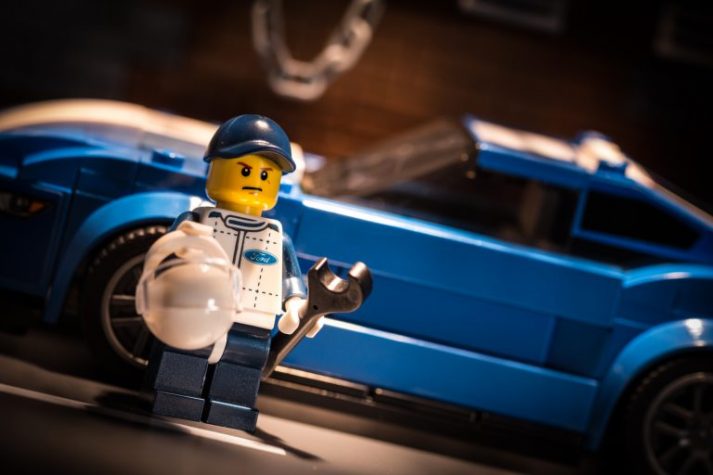 A LEGO ready to fix this car and get his diet in order to tackle his chest fat.