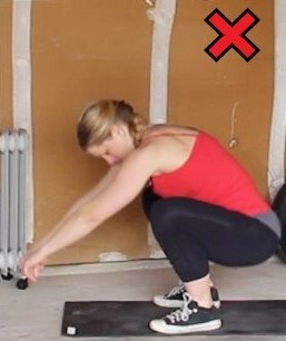 Don't let your back cave in like so when doing squats. 
