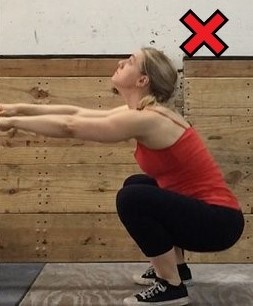 Don't let your head come up like so during your squat movement.