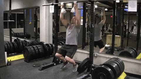 Coach Jim showing you how to perform pull-ups from some sturdy towels.