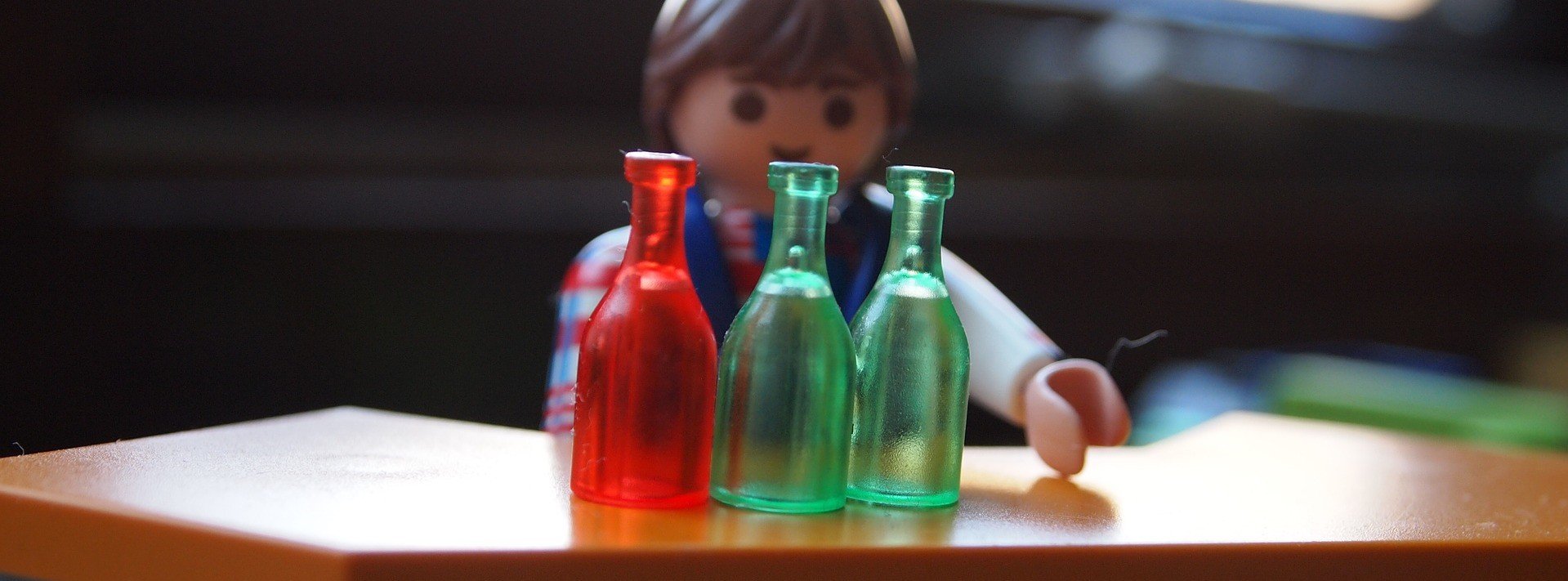 A toy bartender serving some alcohol