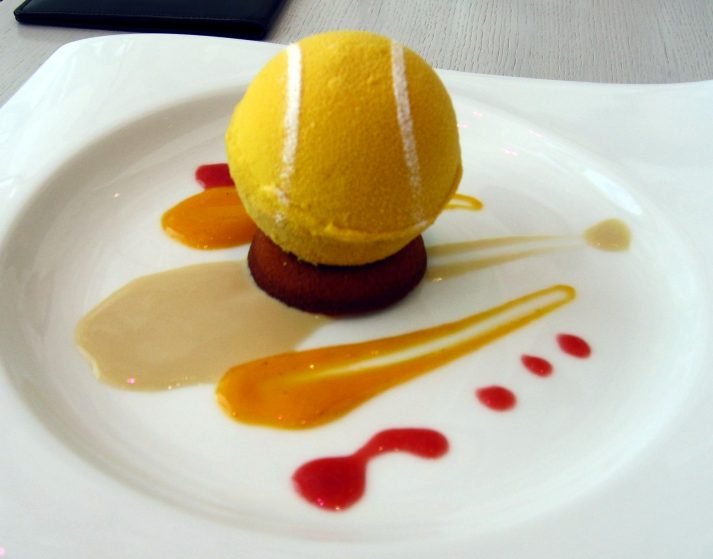 A serving of ice cream is about the size of a tennis ball, cleverly shown here.