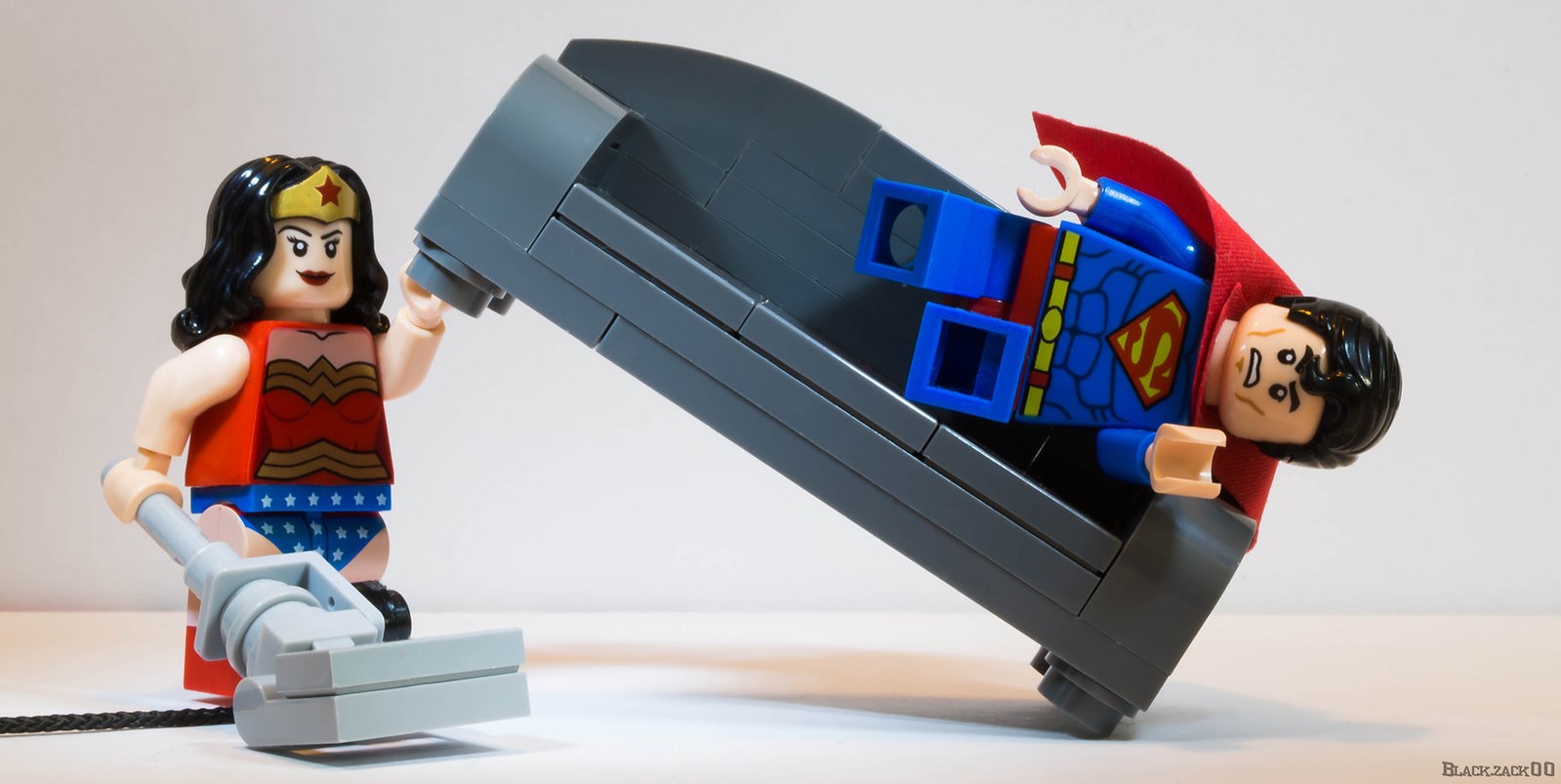 Wonder woman trains at home, to the frustration of Superman.