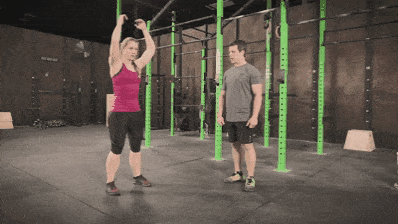 Coach Staci showing you how to perform the jumping squat