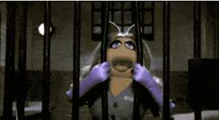 Miss Piggy pulling bars apart in jail.