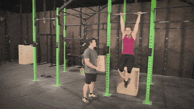 Coach Staci showing you a one arm bar hang