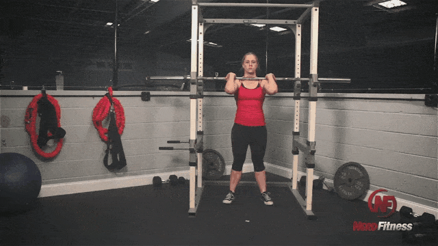 Coach Staci performing the barbell front squat