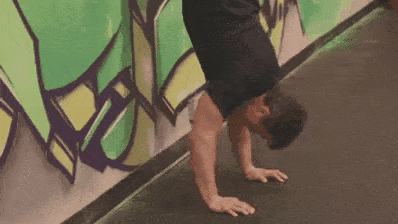 Coach Jim showing you the handstand push-up