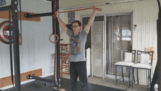 As you pull down on the band, pinch your shoulders together as you go.