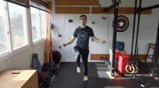 Coach Matt showing you the jump rope high knees, which has alternating legs bringing the knee up for hops.