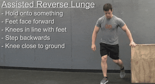 Coach Jim doing an assisted reverse lunge