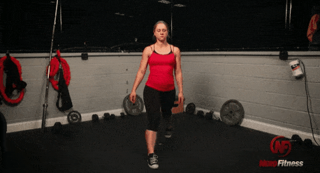 Staci doing a split squat, which is actually a lunge variation.