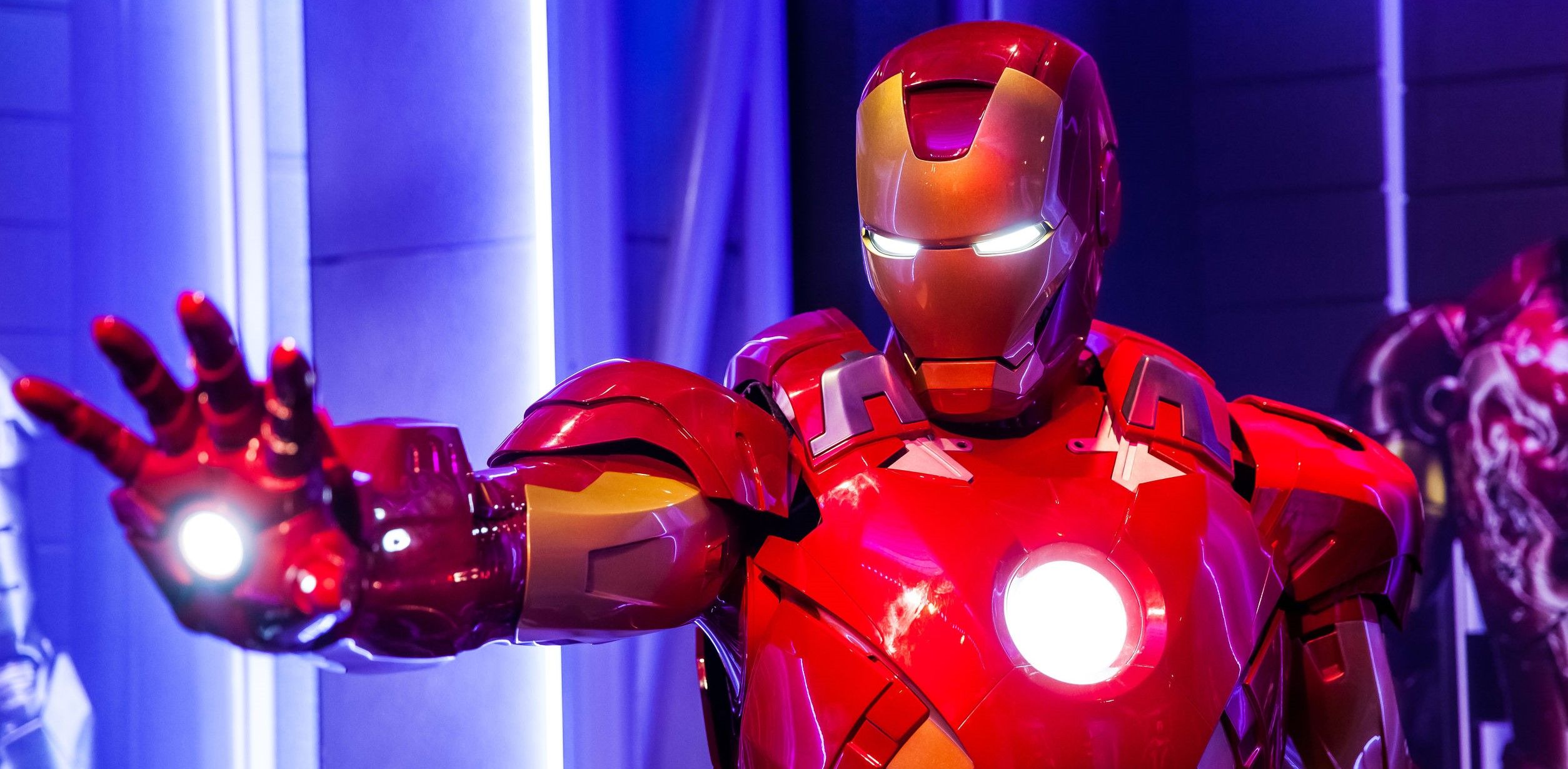 A picture of Iron Man holding up his hand.