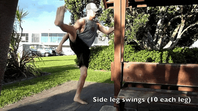 Steve doing a warm up by swinging a leg side to side