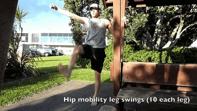 Steve doing forward leg swings for a warm up