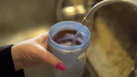 Someone using a protein shaker