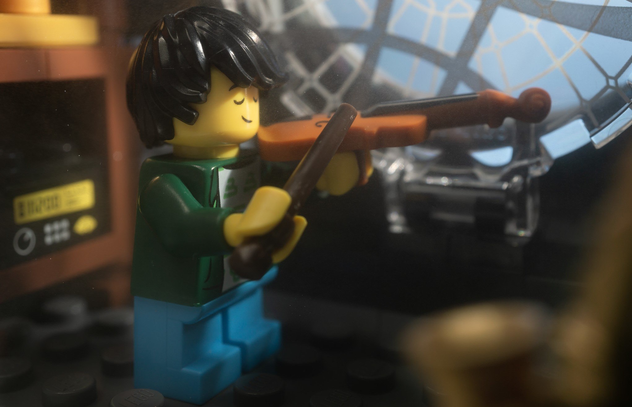 A LEGO playing the violin.