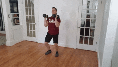 Coach Jim doing a dumbbell jerk
