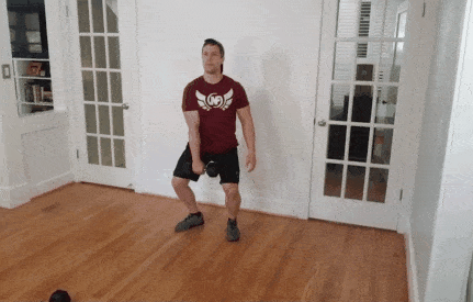 Coach Jim doing a snatch with a dumbbell