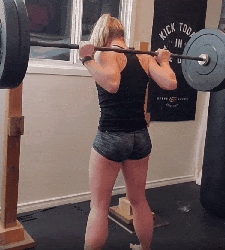 Staci doing a barbell squat