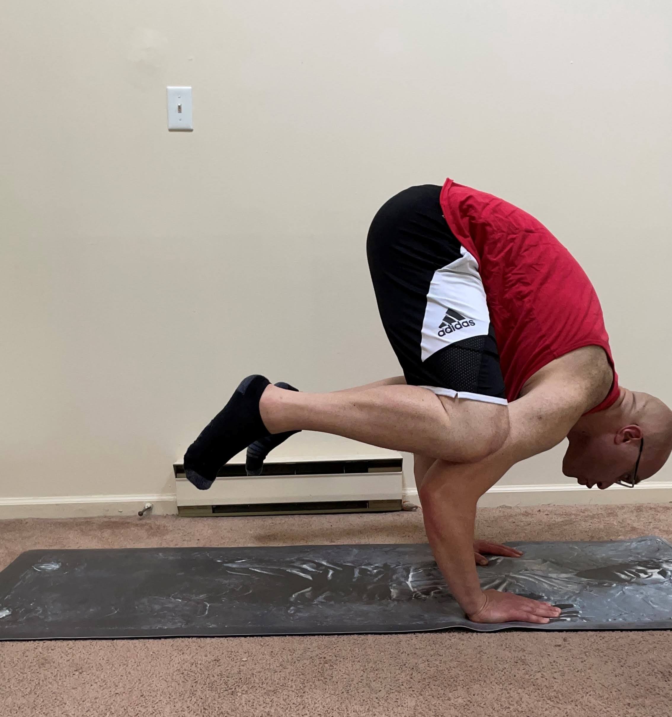 Brian in crow pose on Han Solo yoga mat
