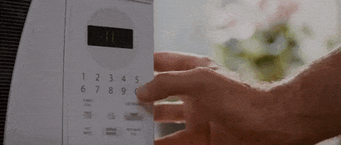 Hand pressing microwave button