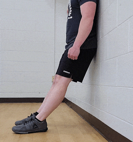 Coach Jim doing a shin raise far from the wall