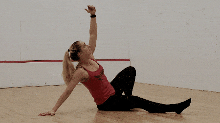 Bring your forearm and elbow down to the ground, continuing to maintain eye contact with your hand (or weight) overhead.