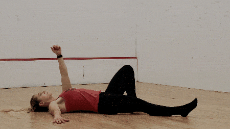 Maintain eye contact with the hand overhead as you roll from your back up onto your opposite forearm.