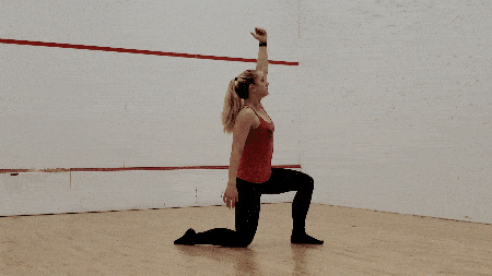 Lower your hand, forming the same stable triangle with your hand, knee, and foot on the ground. 