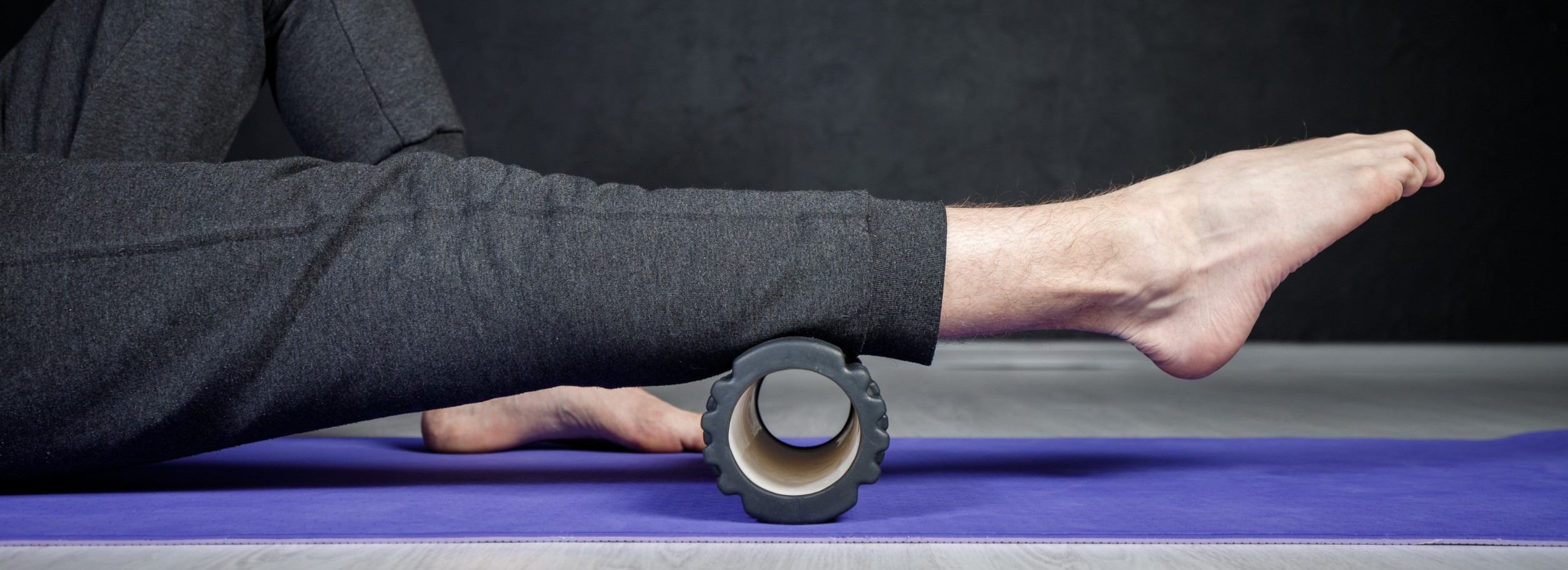 A man using a foam roller