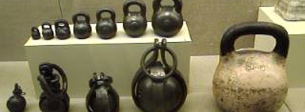 A picture of a bunch of old Kettlebells in a museum in Turkey.