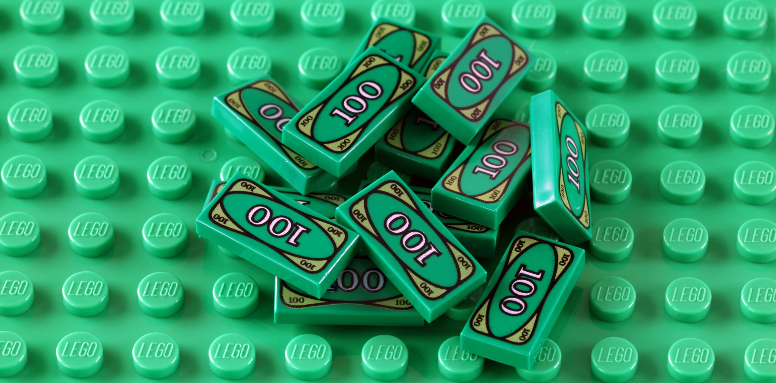 LEGO money on a green baseplate