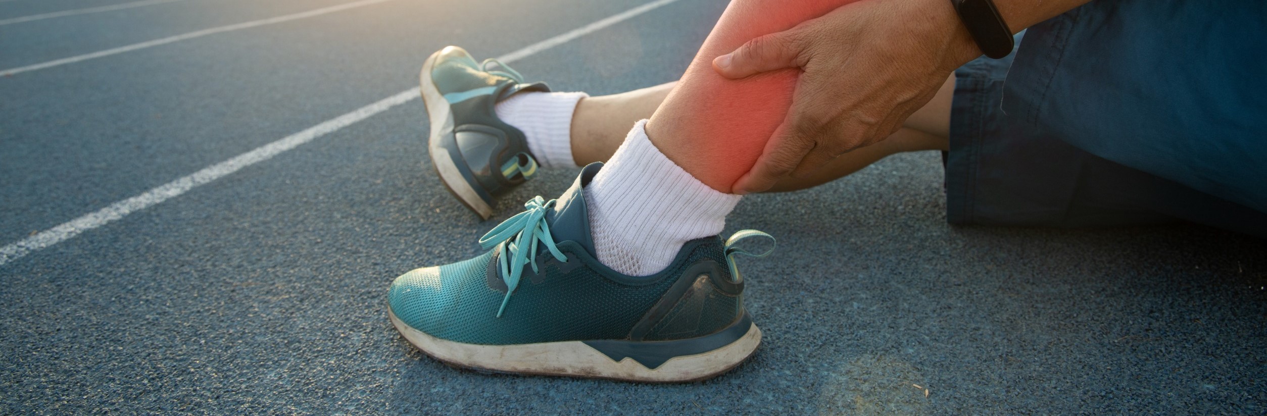 Someone on the ground, with a "red" leg that is sore.